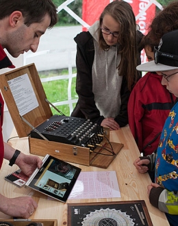 Educational workshop for children and teenagers explaining the operation of the German Enigma coding machine. Photo. Roman Jocher