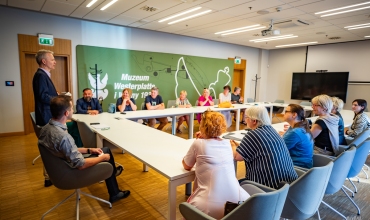 20 PEOPLE BACK AMONG THE WWII GUIDES