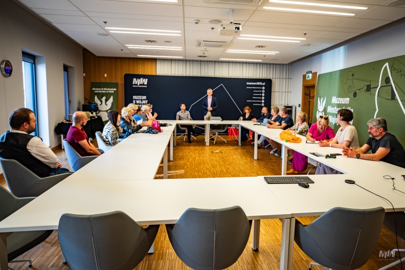 20 PEOPLE BACK AMONG THE WWII GUIDES