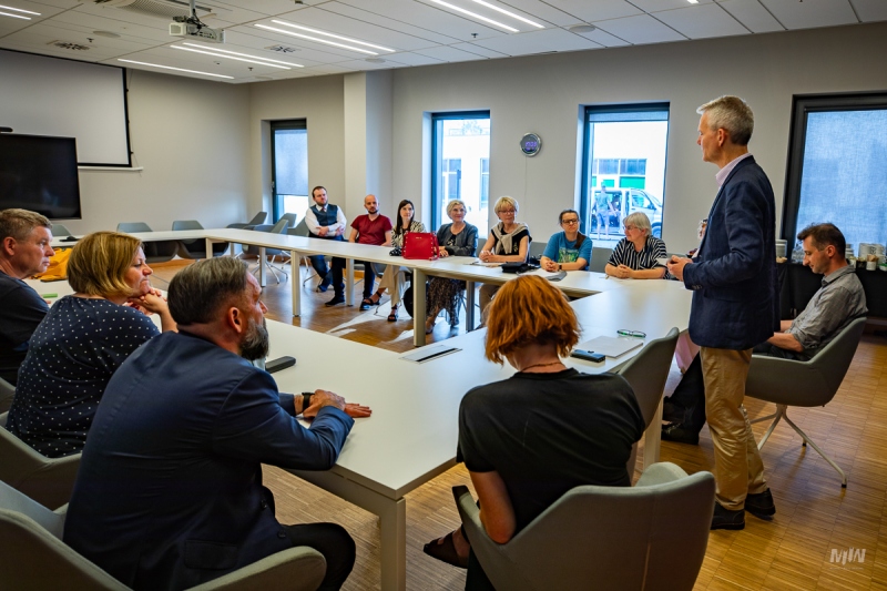 20 PEOPLE BACK AMONG THE WWII GUIDES