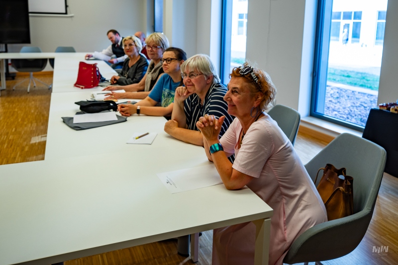 20 PEOPLE BACK AMONG THE WWII GUIDES